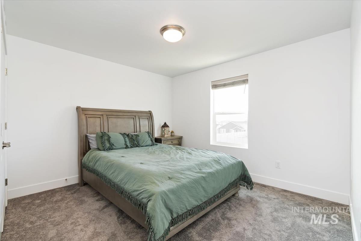 14361 Fractus Drive Caldwell, ID 83607 - Photo 26 of 50 Carpeted bedroom featuring baseboards