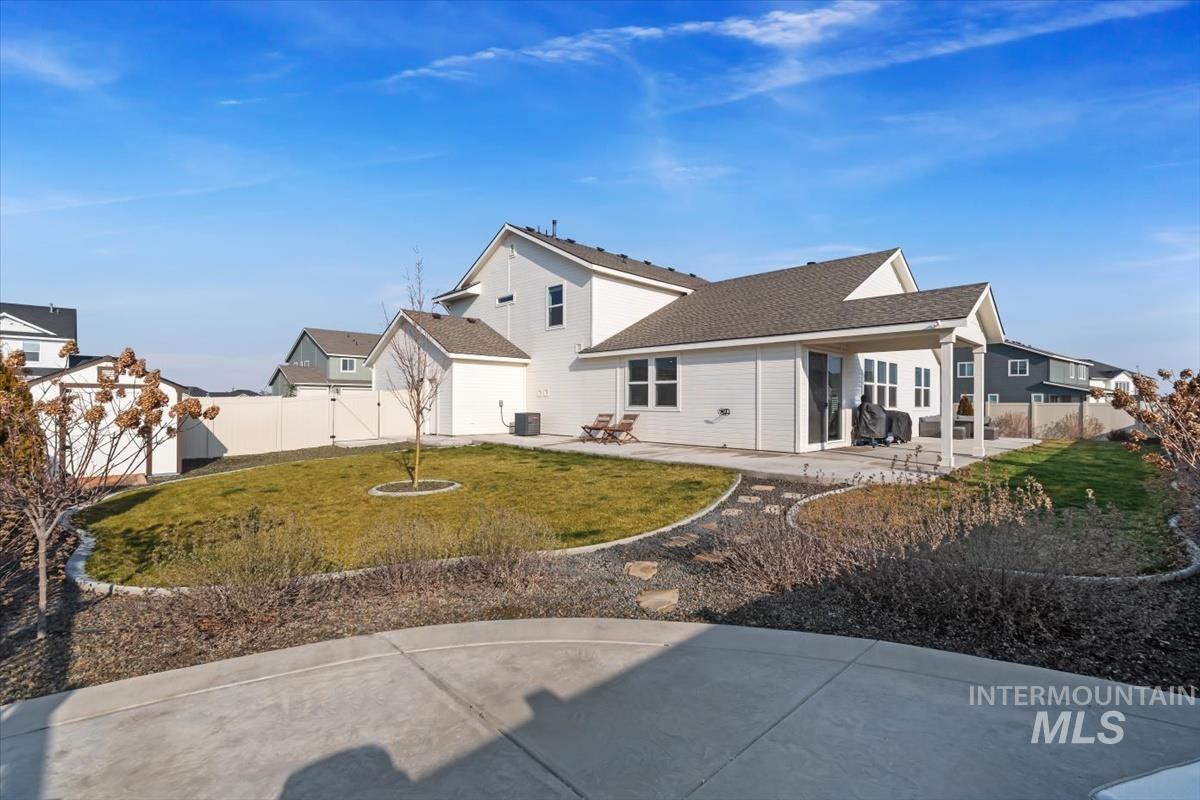 14361 Fractus Drive Caldwell, ID 83607 - Photo 29 of 50 Rear view of property featuring a patio area, a fenced backyard, and roof with shingles