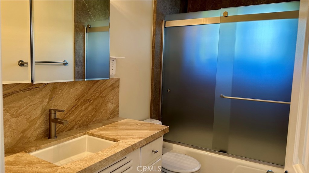 314 Avenida Granada, Unit C San Clemente, CA 92672 - Photo 10 of 13 a bathroom with a sink and a mirror