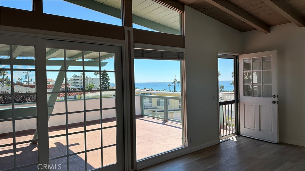 314 Avenida Granada, Unit C San Clemente, CA 92672 - Photo 3 of 13 a view of empty room with wooden floor and fan