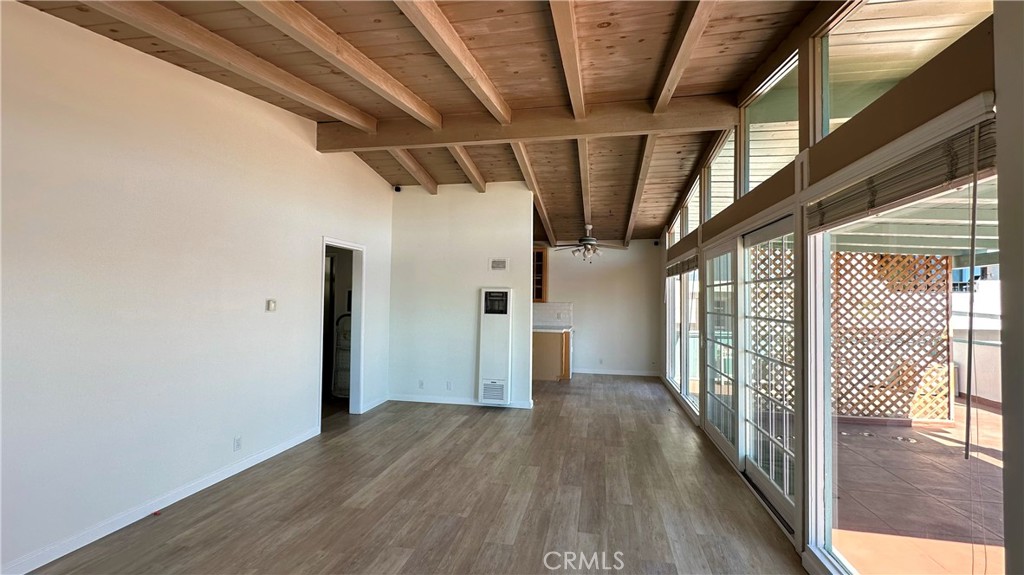 314 Avenida Granada, Unit C San Clemente, CA 92672 - Photo 4 of 13 a view of hallway with wooden floor
