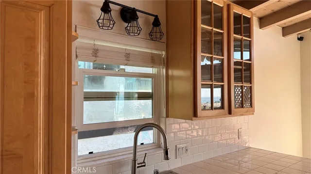 a kitchen with stainless steel appliances granite countertop a refrigerator stove and cabinets