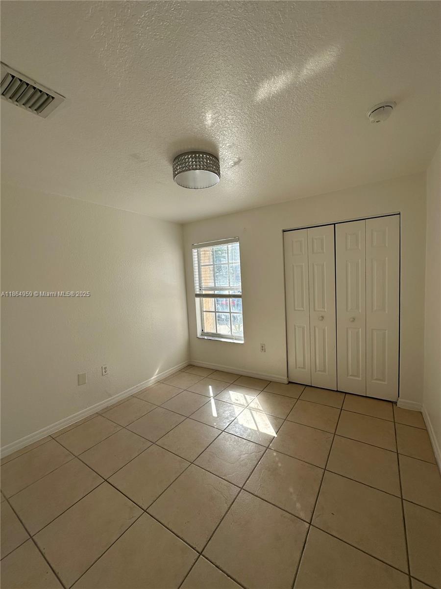 13713 Southwest 171st Lane Miami, FL 33177 - Photo 5 of 18 a view of a livingroom with a window