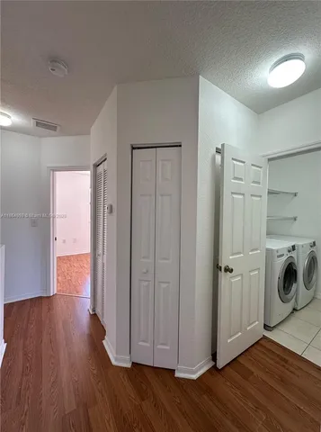 a view of a storage & utility room with wooden floor