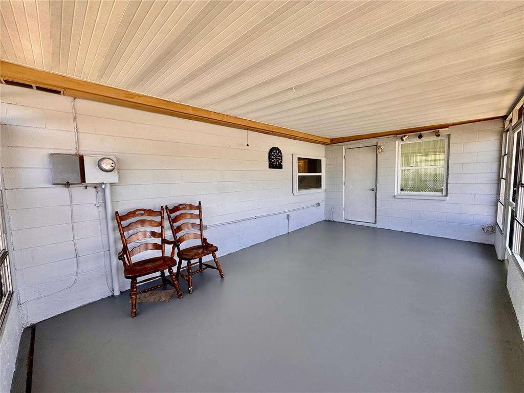 3902 Glissade Drive New Port Richey, FL 34652 - Photo 22 of 26 a view of a livingroom with furniture and windows