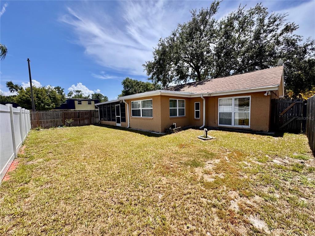 3902 Glissade Drive New Port Richey, FL 34652 - Photo 25 of 26 front view of a house with a yard