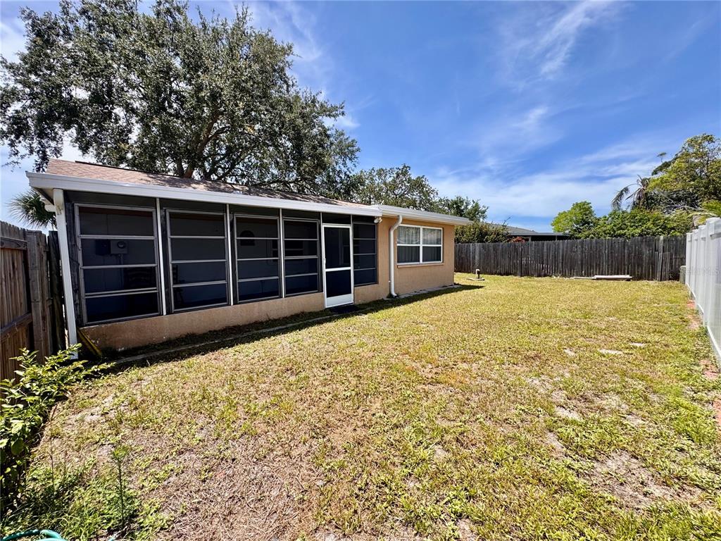 3902 Glissade Drive New Port Richey, FL 34652 - Photo 26 of 26 a view of a house with a yard