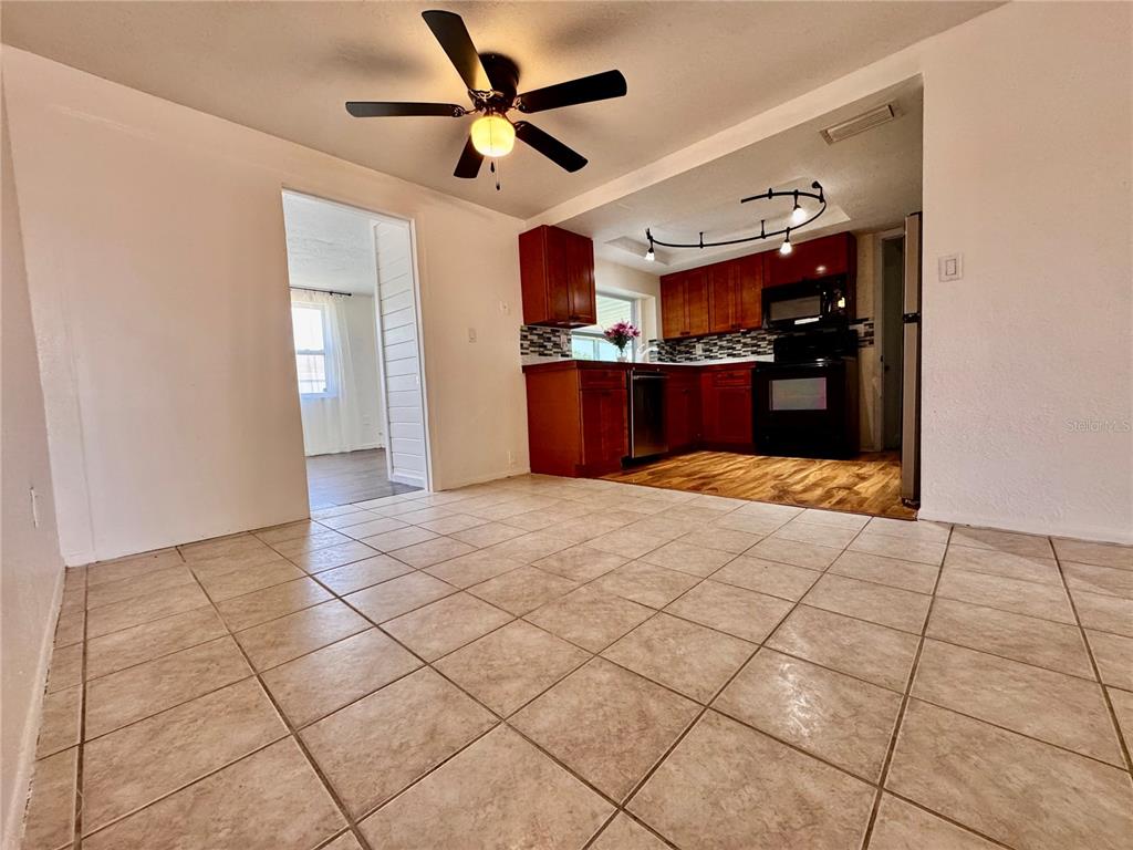 3902 Glissade Drive New Port Richey, FL 34652 - Photo 7 of 26 a view of a livingroom with a ceiling fan and window