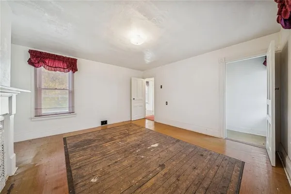 a view of an empty room and window