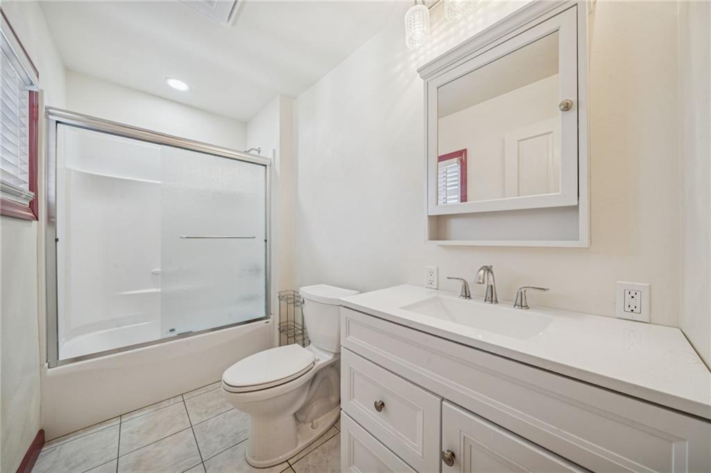 1280 Armstrong Street Irwin, PA 15642 - Photo 16 of 36 a bathroom with a sink a toilet and shower