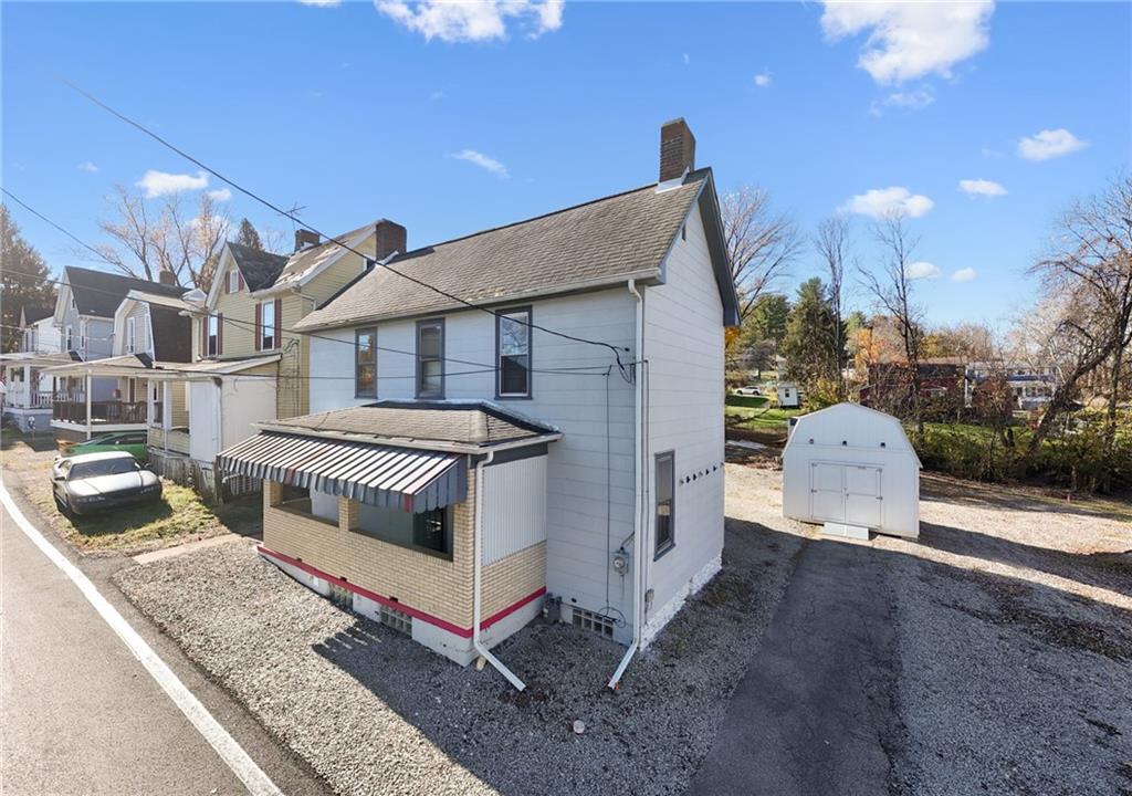 1280 Armstrong Street Irwin, PA 15642 - Photo 17 of 36 a front view of a house with a garden