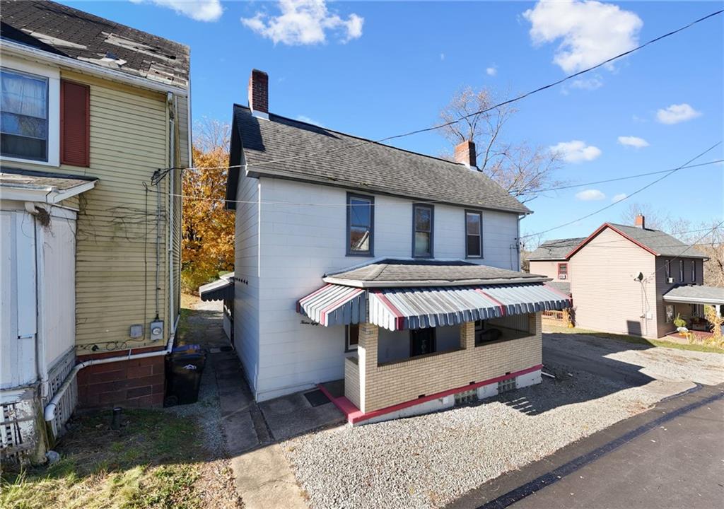 1280 Armstrong Street Irwin, PA 15642 - Photo 29 of 36 a view of a front door and bedroom with a couch