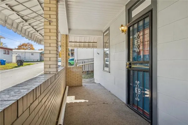 a view of a balcony with wooden floor