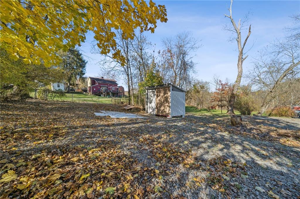 1280 Armstrong Street Irwin, PA 15642 - Photo 33 of 36 a view of a backyard with large trees