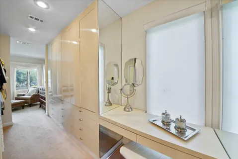 a bathroom with a sink double vanity and a mirror