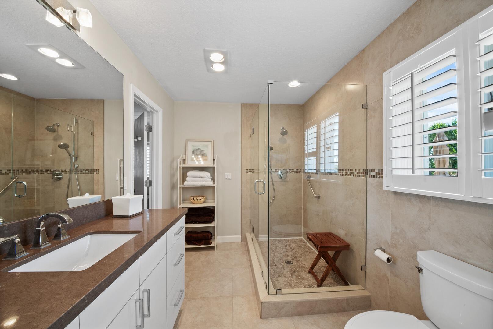 7 Inlet Cay Drive Ocean Ridge, FL 33435 - Photo 25 of 54 a bathroom with a double vanity sink toilet and shower