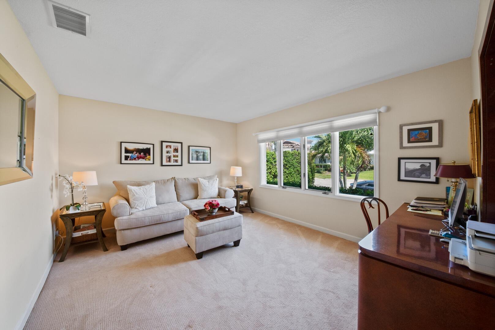 7 Inlet Cay Drive Ocean Ridge, FL 33435 - Photo 26 of 54 a living room with furniture and a large window