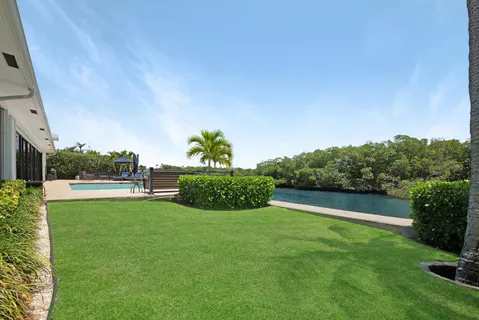 a view of a lake with houses in the back