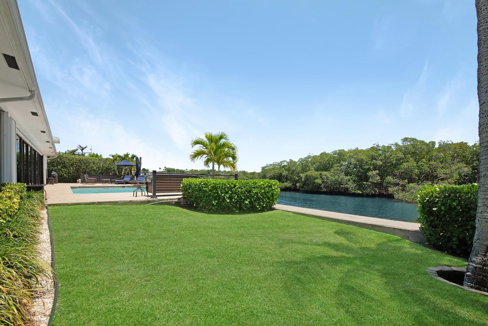 7 Inlet Cay Drive Ocean Ridge, FL 33435 - Photo 35 of 54 a view of a garden and basketball court