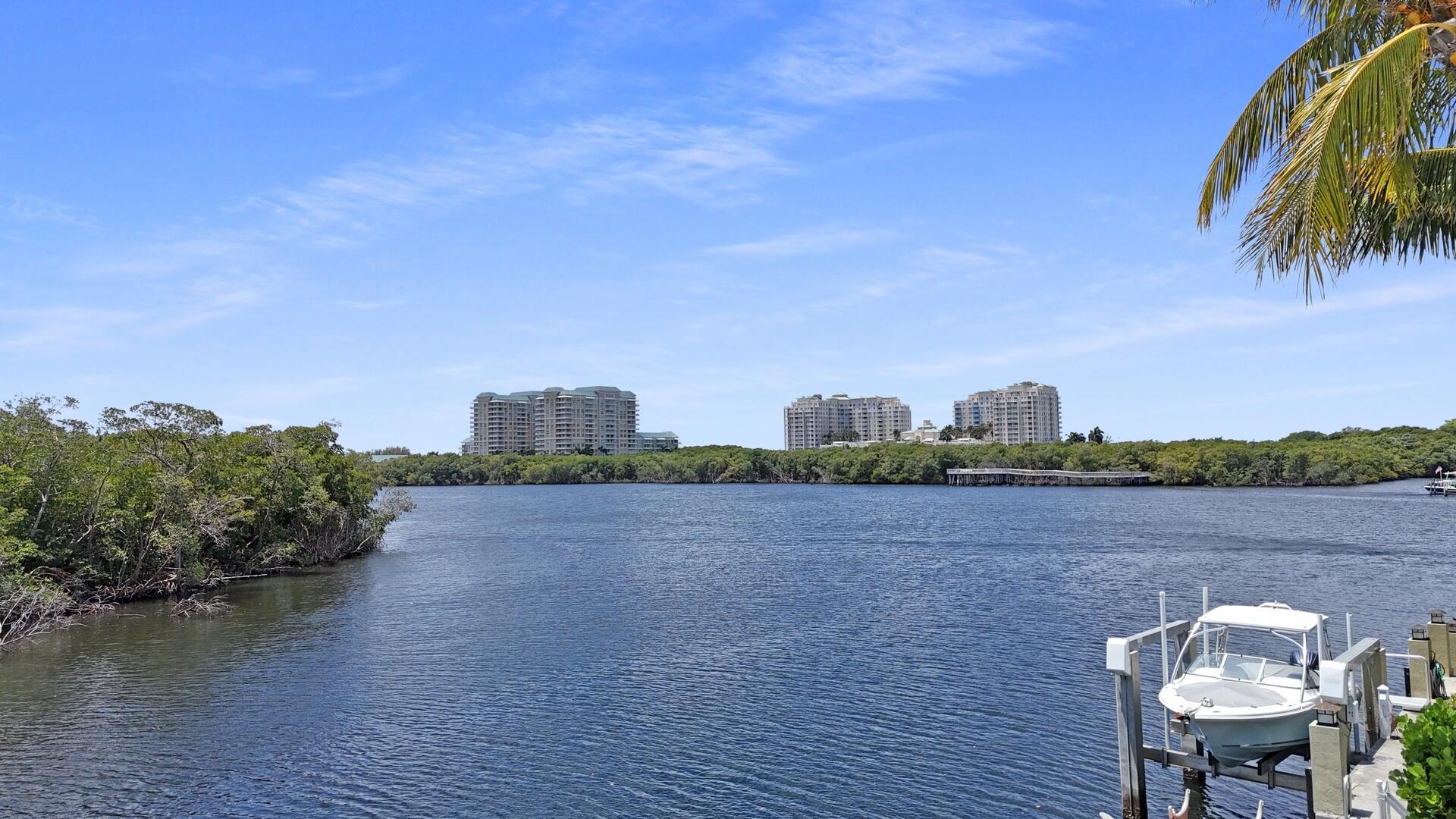 7 Inlet Cay Drive Ocean Ridge, FL 33435 - Photo 39 of 54 a view of a city from a lake