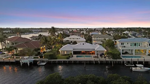 an aerial view of a city with ocean view