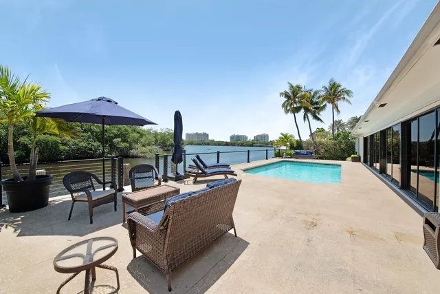 a view of a patio with swimming pool