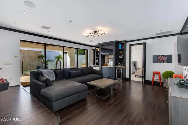 a bedroom with a bed and a large window