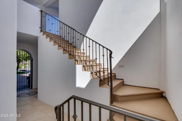 a livingroom with workspace and a window