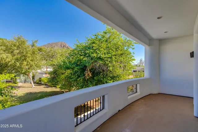 a view of a balcony with chairs