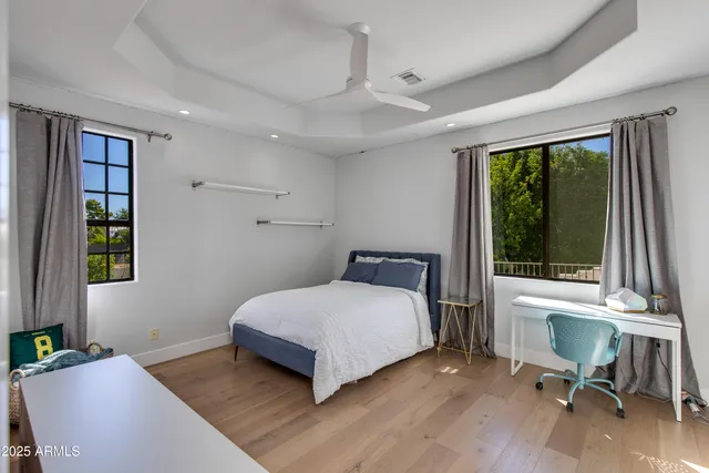 a bedroom with a bed and a table in it