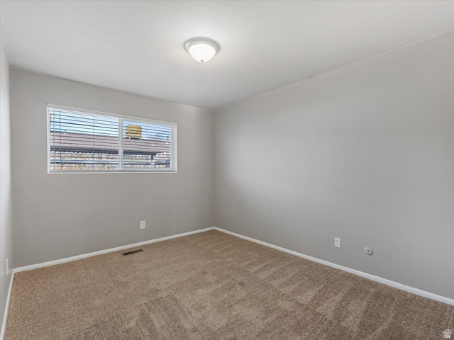 1478 North 75 West, Unit AD Sunset, UT 84015 - Photo 14 of 26 Unfurnished room featuring carpet floors and baseboards
