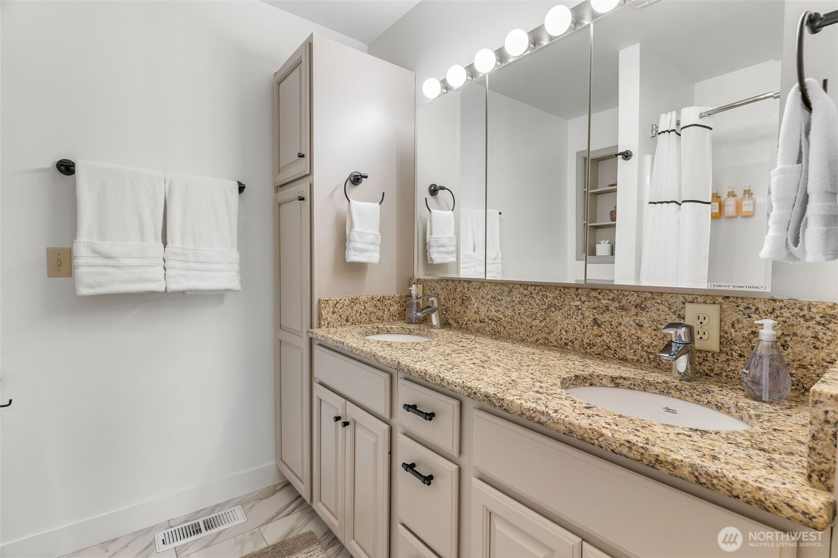 32 Midland Road Brewster, WA 98812 - Photo 20 of 40 a bathroom with a granite countertop sink and a mirror
