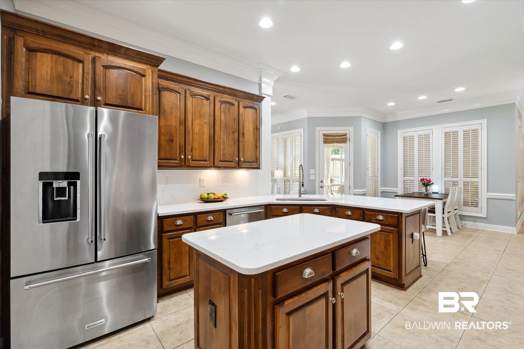 804 Country Club Road Mobile, AL 36609 - Photo 8 of 63 Kitchen with light tile patterned flooring, a kitchen island, appliances with stainless steel finishes, sink, and ornamental molding
