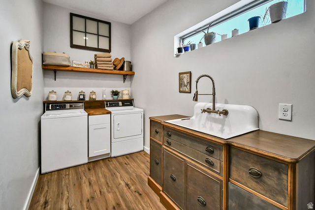 544 East 600 North, Unit 1 Joseph, UT 84739 - Photo 32 of 65 Laundry room featuring wood-finish flooring, a white porcelain utility sink with a high-arc faucet, and wood shelving