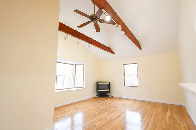 a view of empty room with windows