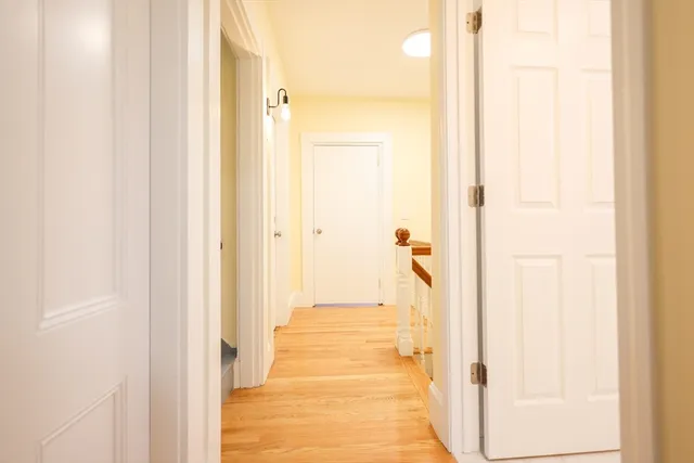 a view of a bathroom from a corridor