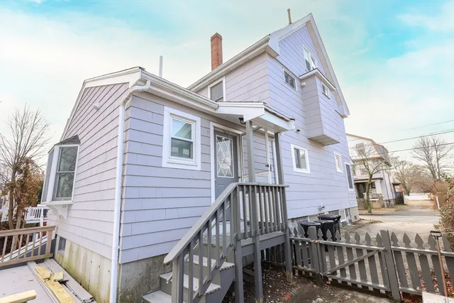 a view of a house with iron fence