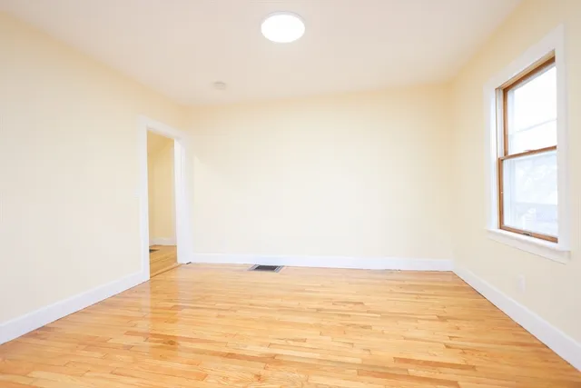 a view of an empty room and window