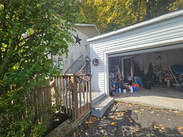 a view of a patio with table and chairs and potted plants