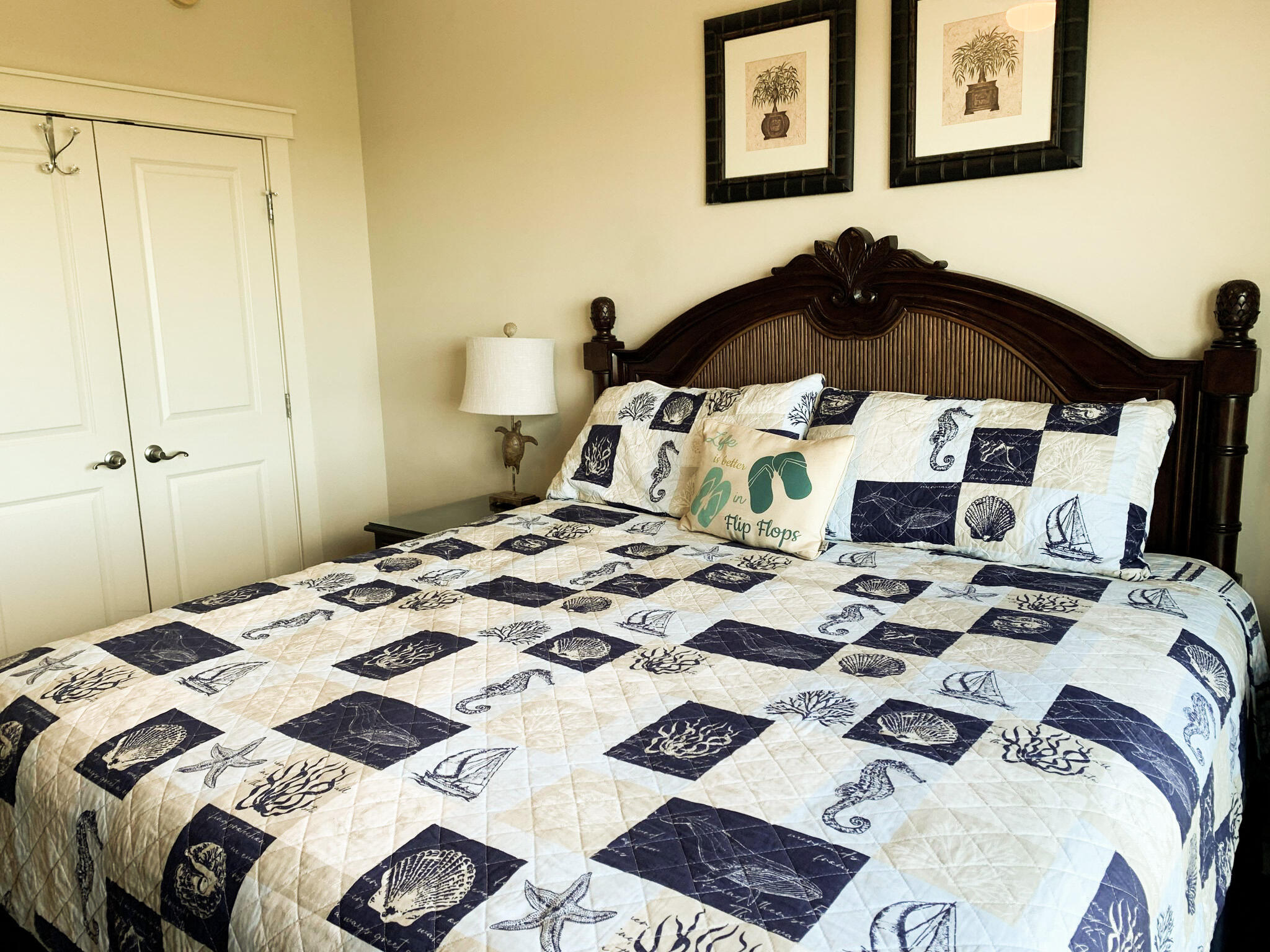 15100 Front Beach Road, Unit 919 921 Panama City Beach, FL 32413 - Photo 26 of 49 a bed sitting in a bedroom next to a bathroom sink