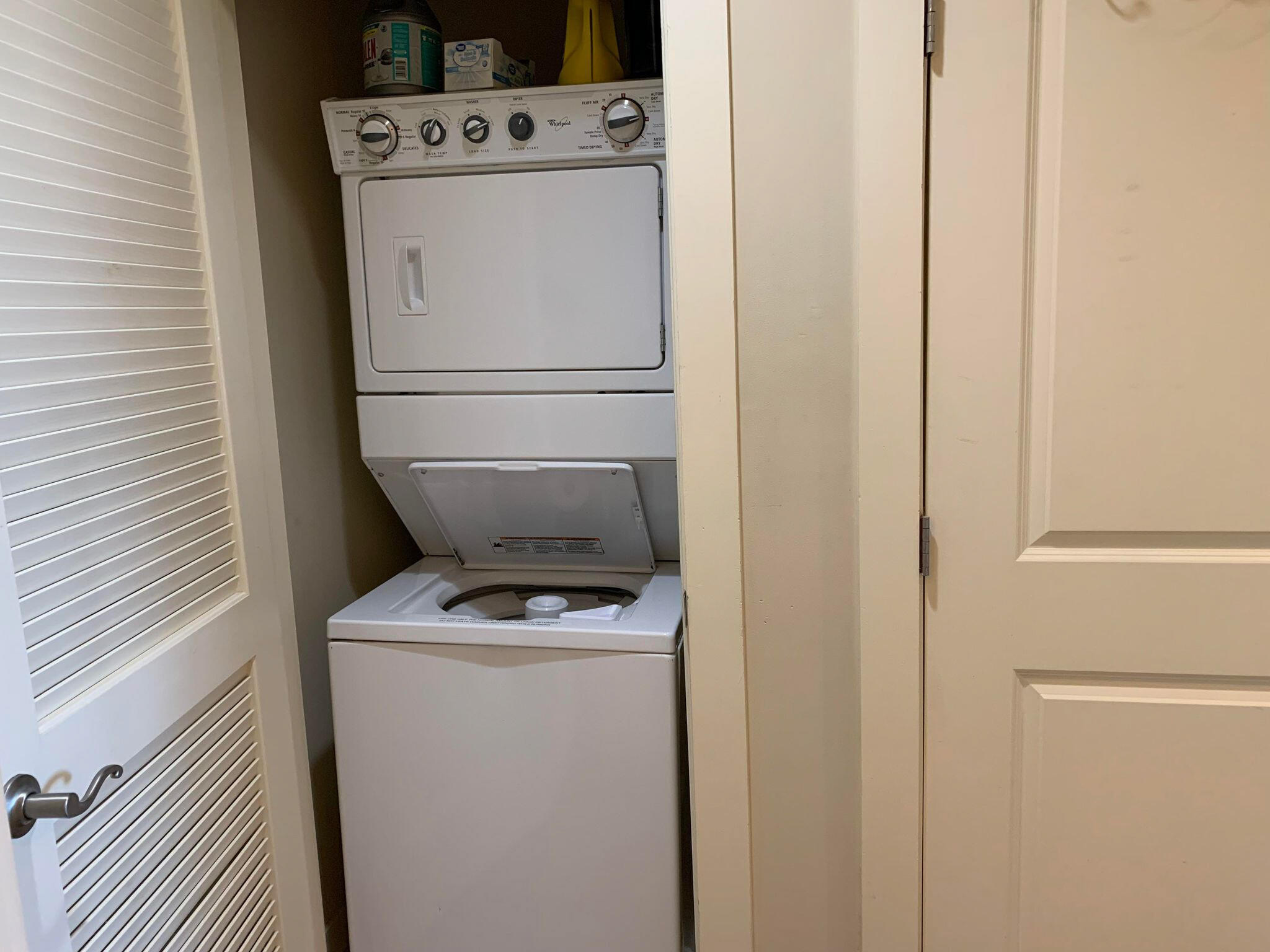 15100 Front Beach Road, Unit 919 921 Panama City Beach, FL 32413 - Photo 29 of 49 a utility room with dryer and washer