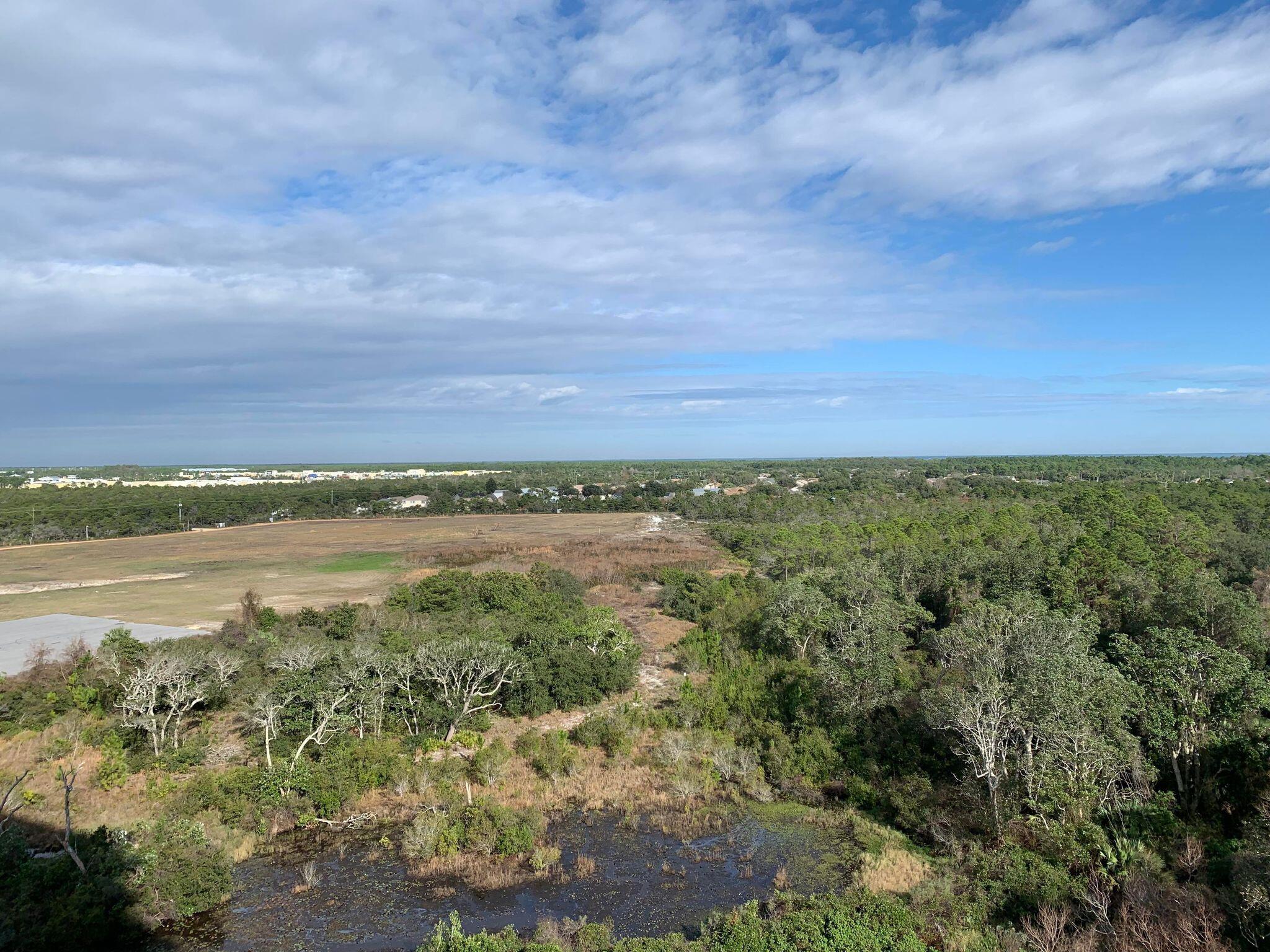 15100 Front Beach Road, Unit 919 921 Panama City Beach, FL 32413 - Photo 36 of 49 a view of a lake with a city