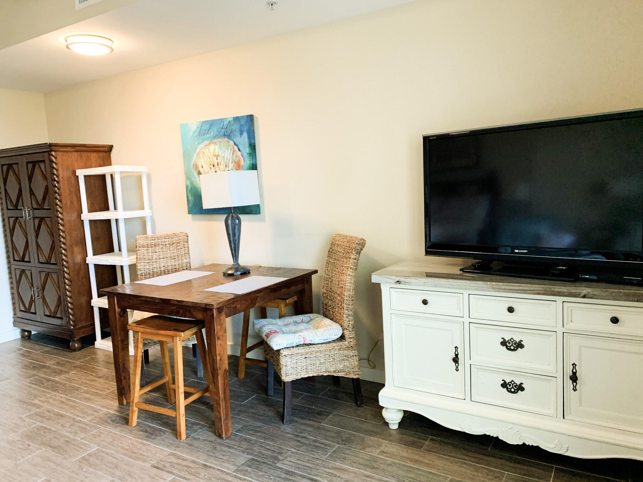 15100 Front Beach Road, Unit 919 921 Panama City Beach, FL 32413 - Photo 7 of 49 a living room with furniture and a flat screen tv