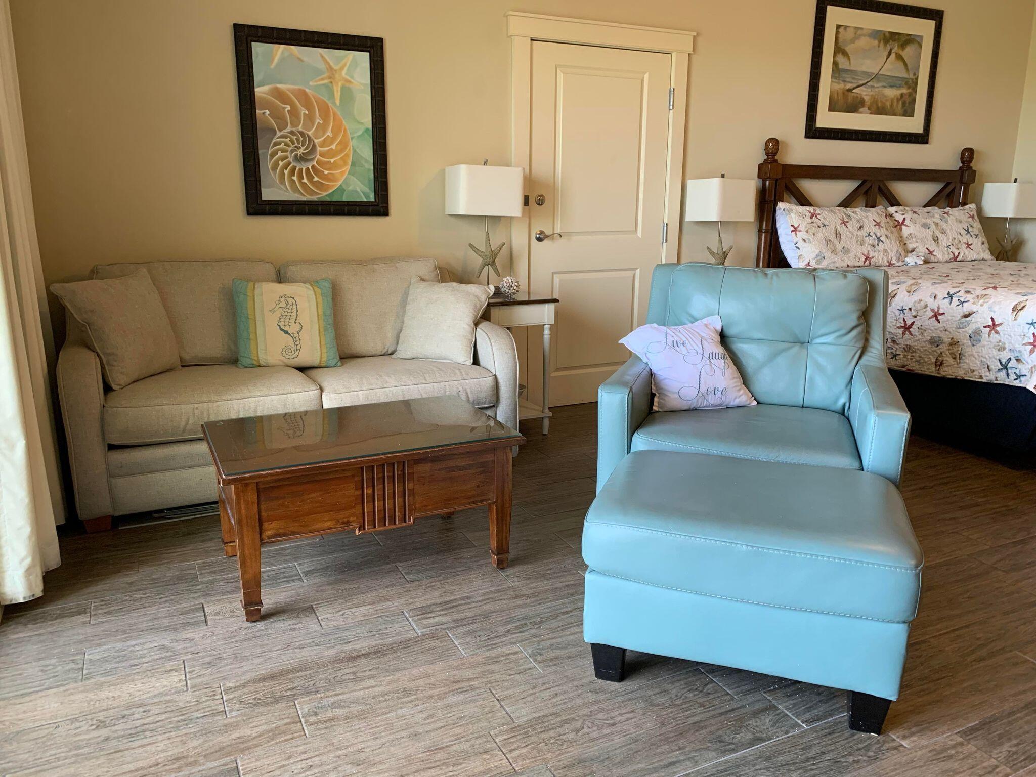 15100 Front Beach Road, Unit 919 921 Panama City Beach, FL 32413 - Photo 10 of 49 a living room with furniture and a wooden floor