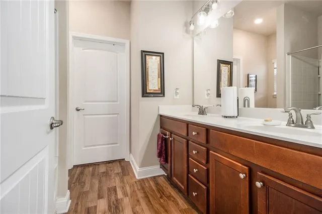 a spacious bathroom with a double vanity sink and a mirror