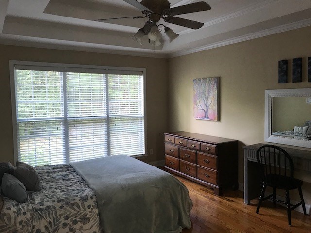 204 Ridge Point Way Macon, GA 31220 - Photo 15 of 22 a bedroom with a bed and a chandelier