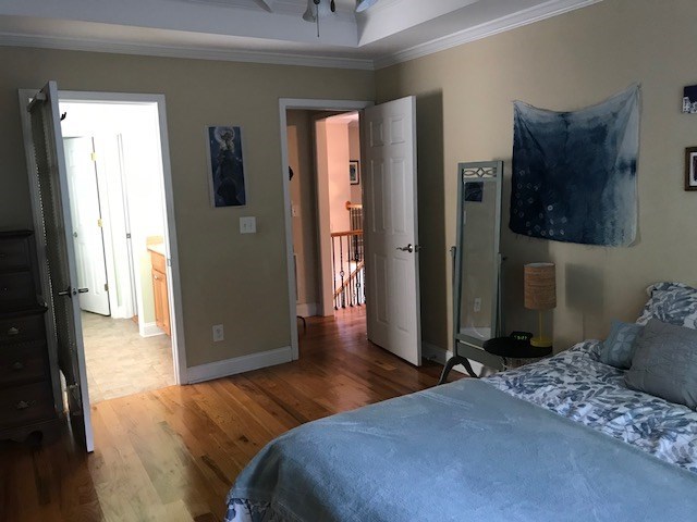 204 Ridge Point Way Macon, GA 31220 - Photo 16 of 22 a bedroom with a bed and wooden floor