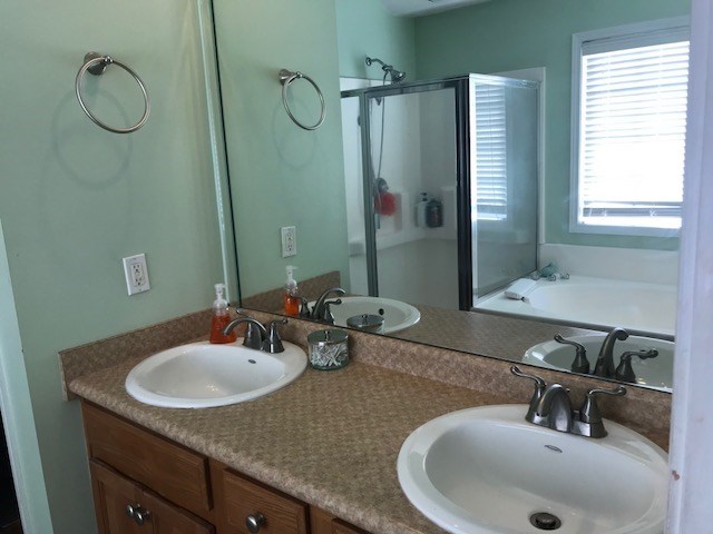 204 Ridge Point Way Macon, GA 31220 - Photo 18 of 22 a bathroom with a sink double vanity and a mirror