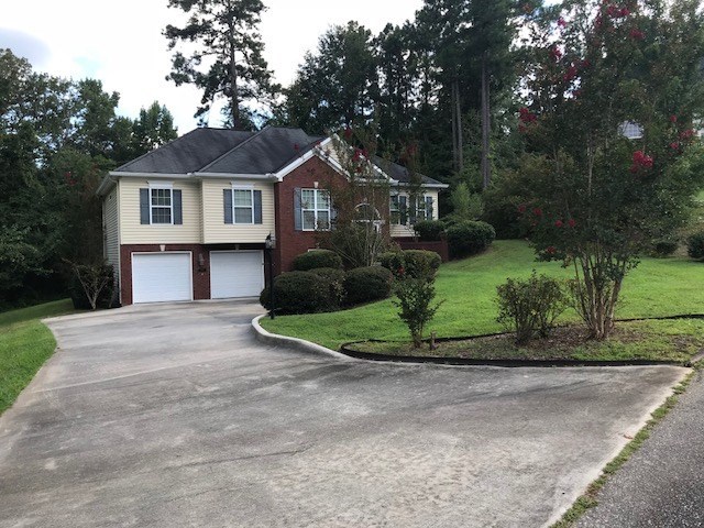 204 Ridge Point Way Macon, GA 31220 - Photo 22 of 22 a front view of a house with a yard and garage