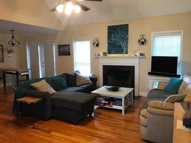 204 Ridge Point Way Macon, GA 31220 - Photo 5 of 22 a living room with furniture a flat screen tv and a fireplace